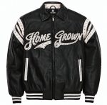 The Legacy Leather jacket front: black genuine leather with studded white Home Grown script and studded white shoulder stripes