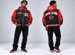 Model wearing the Home Grown Hustler Ragin' Cajuns hooded varsity jacket in black and red, front and back views