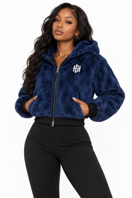 Model wearing the Home Grown Hustler Legacy Zip women's cropped royal blue faux fur hoodie