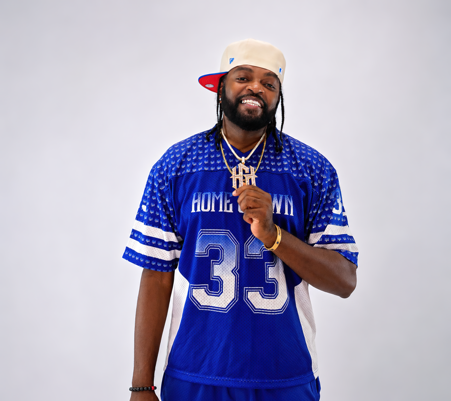 Slim wearing the Home Grown Hustler #33 royal blue jersey